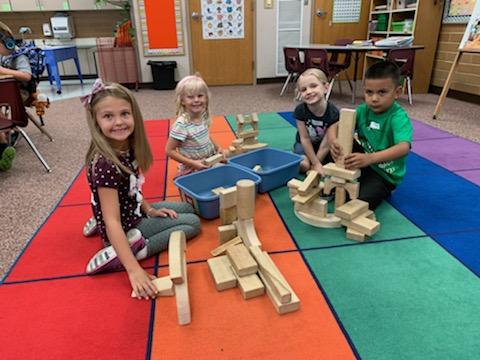 Kindergarteners learning how to play together. 