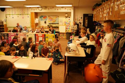 Mrs Victoria Terry's 2nd grade class listening to a presentation about Neil Armstrong