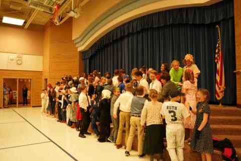 5th graders performing for their parents