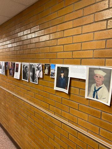 The wall of Veterans that students brought in