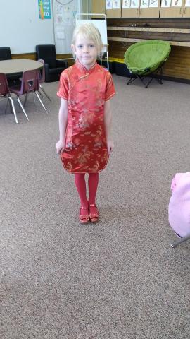 A student showing her traditional Chinese clothing.