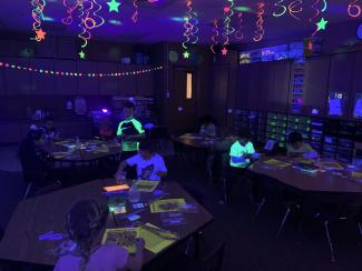 Students in Ms Orton's class got to work by black light.